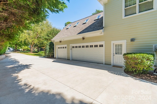 view of property exterior with a garage