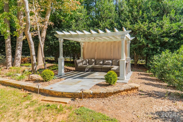 view of yard featuring an outdoor living space, a patio area, and a pergola