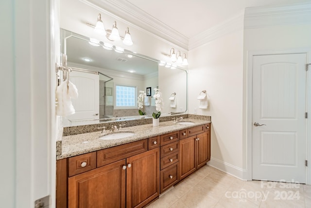 bathroom featuring vanity, crown molding, and tile patterned flooring