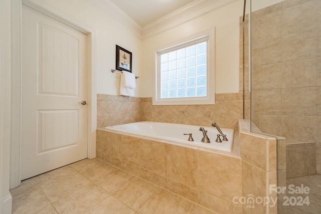 bathroom featuring ornamental molding, tiled tub, and tile patterned flooring