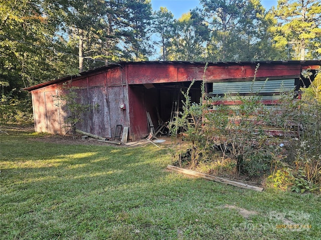 view of outbuilding with a lawn