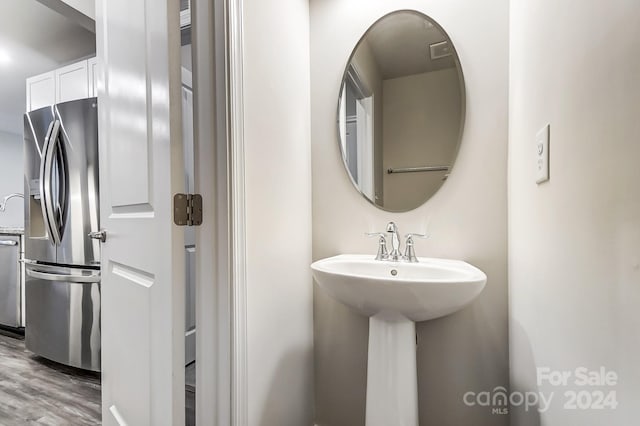 bathroom featuring hardwood / wood-style floors and sink