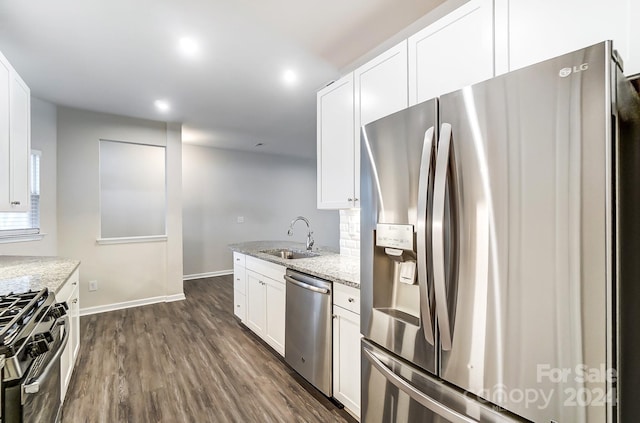 kitchen featuring white cabinetry, sink, and appliances with stainless steel finishes