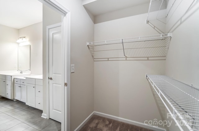 spacious closet with light tile patterned flooring