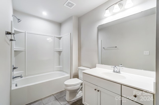 full bathroom with bathing tub / shower combination, tile patterned floors, vanity, and toilet