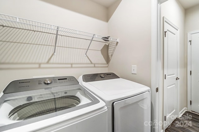 laundry room featuring wood-type flooring and independent washer and dryer