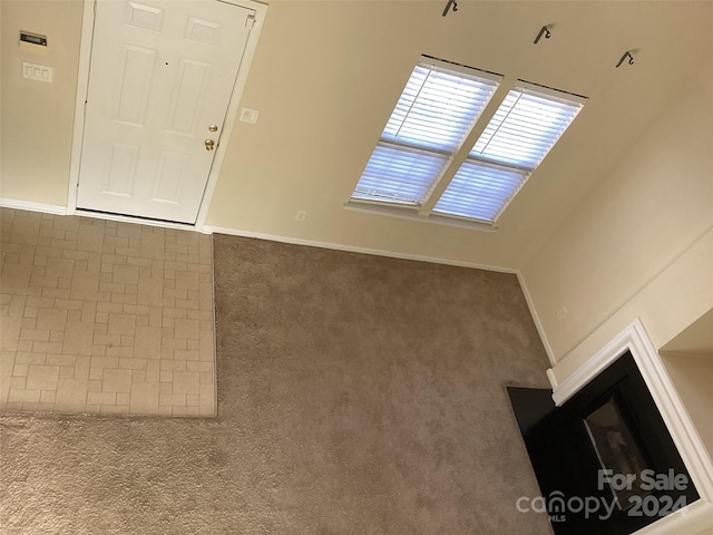 interior space with dark colored carpet