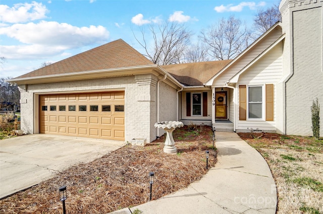 ranch-style home featuring a garage