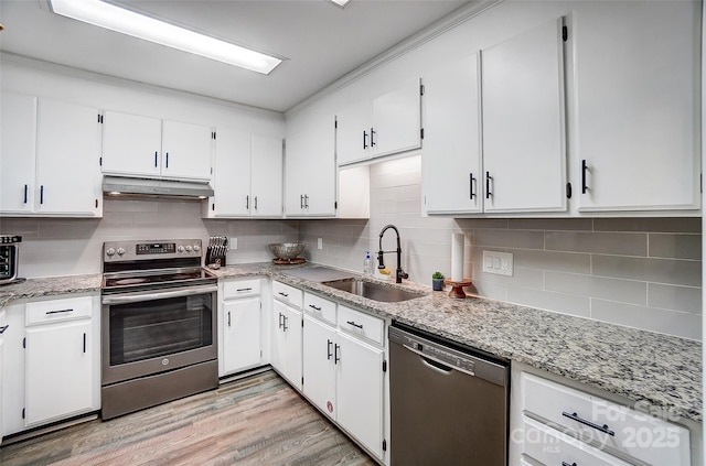 kitchen featuring black dishwasher, sink, white cabinets, and stainless steel electric range