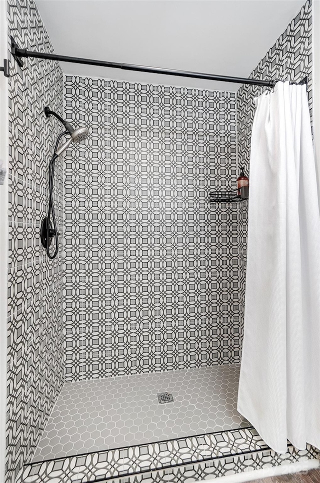 bathroom with a shower with curtain