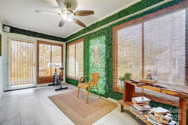 sunroom / solarium with ceiling fan