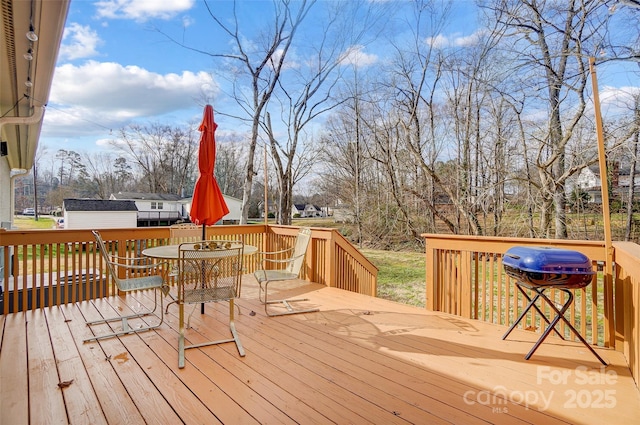 wooden terrace with area for grilling