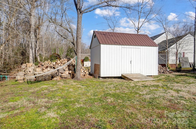 view of outdoor structure with a lawn