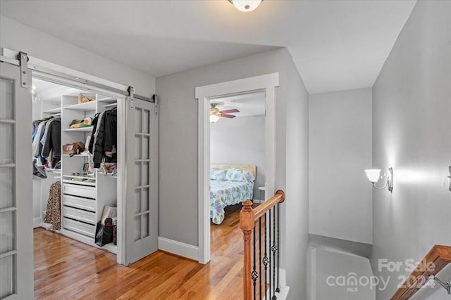 interior space with a barn door and light wood-type flooring