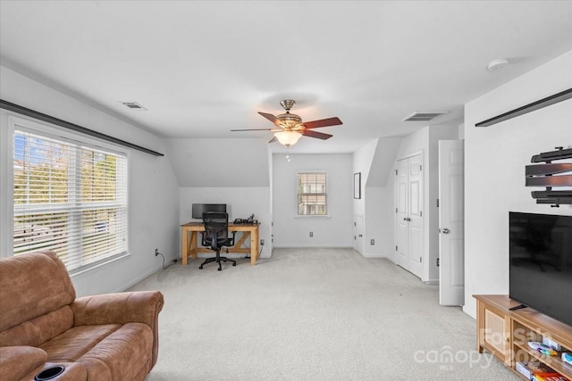 carpeted home office featuring ceiling fan and lofted ceiling