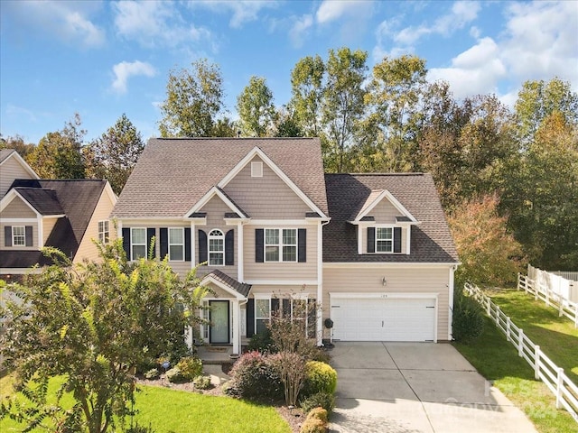 view of front facade with a garage and a front lawn