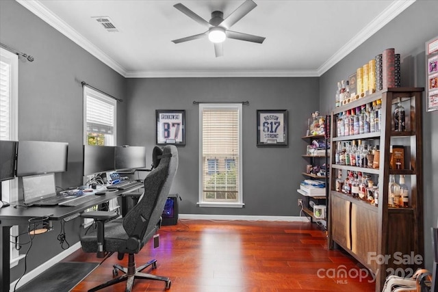 office space with ceiling fan, dark hardwood / wood-style flooring, and ornamental molding