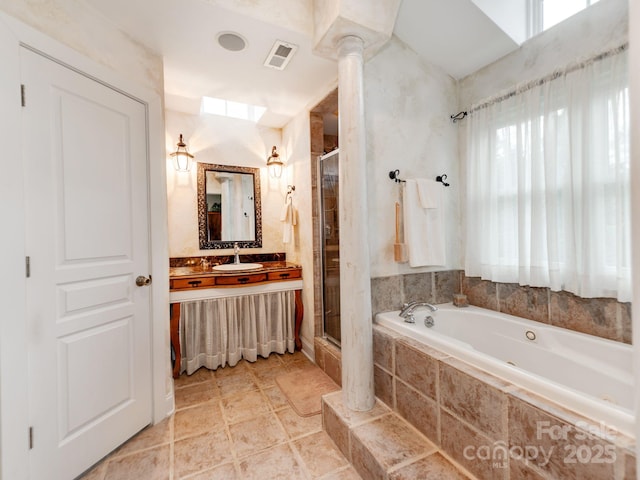 full bath with visible vents, a shower stall, vanity, ornate columns, and a tub with jets