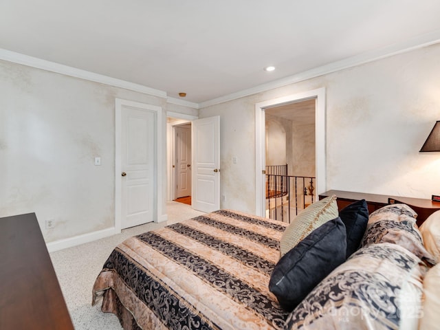 bedroom with carpet floors, recessed lighting, ornamental molding, and baseboards