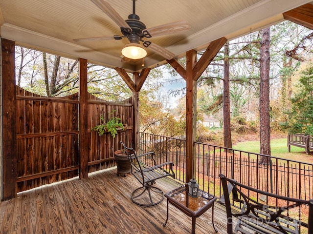 wooden deck featuring a ceiling fan