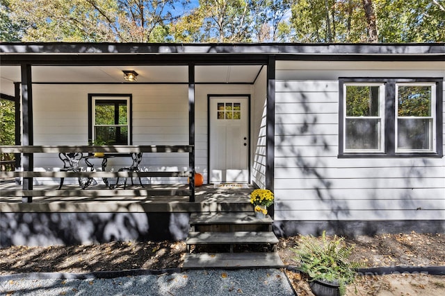 property entrance featuring covered porch