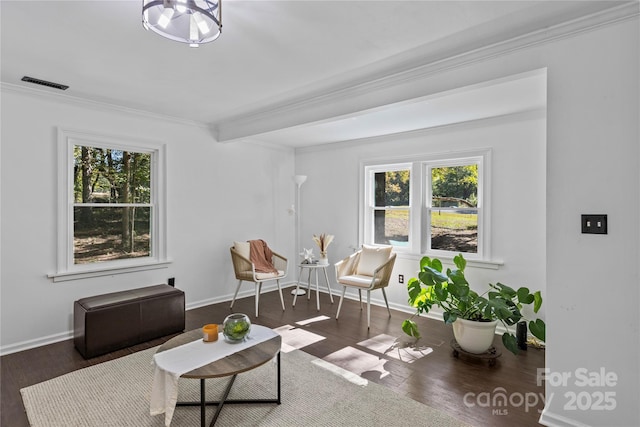 living room featuring dark hardwood / wood-style floors and ornamental molding