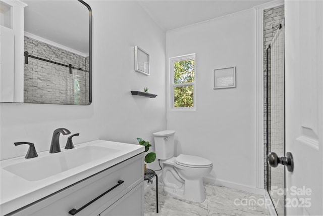 bathroom featuring vanity, toilet, an enclosed shower, and ornamental molding