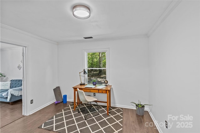 home office featuring ornamental molding and hardwood / wood-style flooring