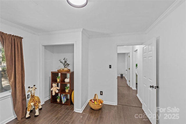 hallway with dark hardwood / wood-style floors and ornamental molding