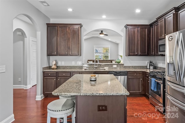 3157 Delaware Dr, Denver, NC 28037 - kitchen featuring arched walkways, a breakfast bar, stainless steel appliances, a sink, and visible vents