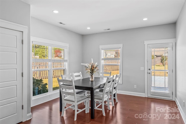 3157 Delaware Dr, Denver, NC 28037 - dining space featuring dark wood-style floors, visible vents, a wealth of natural light, and baseboards