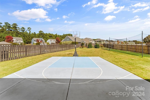 3157 Delaware Dr, Denver, NC 28037 - view of basketball court featuring basketball court, a yard, a residential view, and a fenced backyard