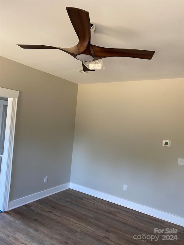 spare room with dark hardwood / wood-style flooring