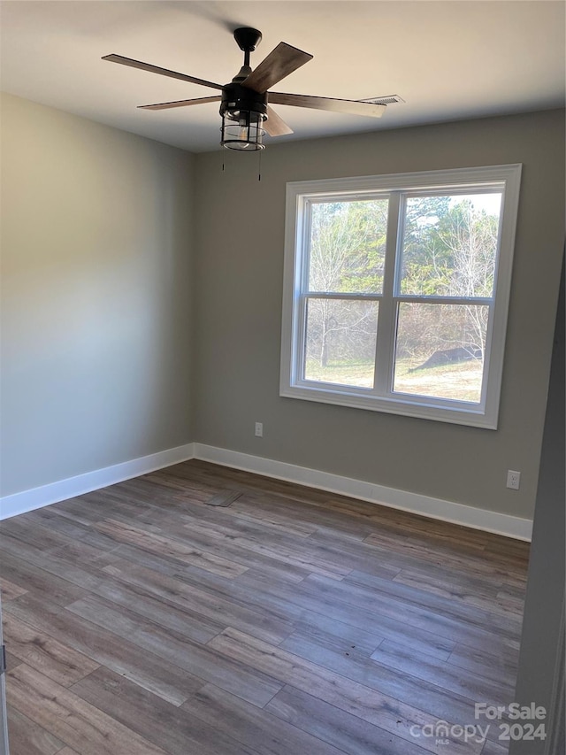 unfurnished room featuring ceiling fan and hardwood / wood-style flooring