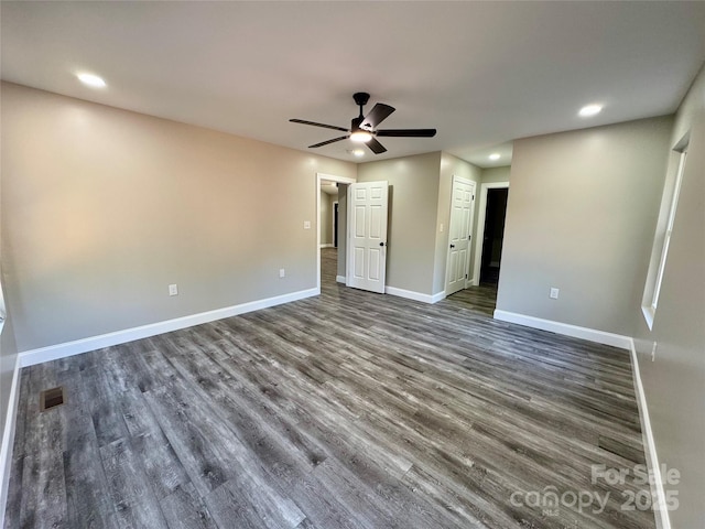 unfurnished bedroom featuring dark wood-style floors, recessed lighting, visible vents, ceiling fan, and baseboards