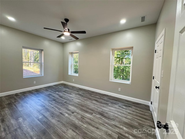 unfurnished bedroom featuring dark wood-style floors, recessed lighting, visible vents, and baseboards