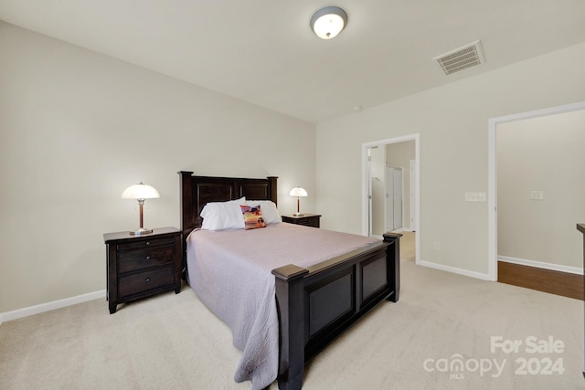 bedroom with light colored carpet