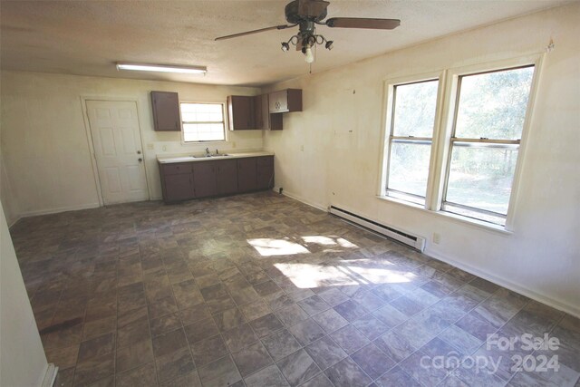 521 Short St Unit 8, Morven, NC 28119 - kitchen with a baseboard radiator, a ceiling fan, light countertops, baseboards, and a sink