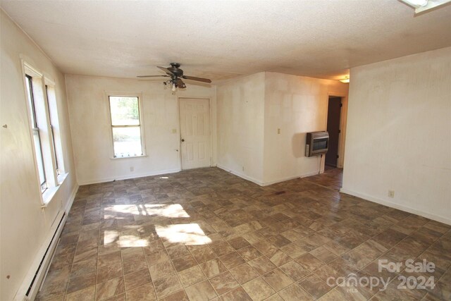 521 Short St Unit 8, Morven, NC 28119 - unfurnished room with a baseboard heating unit, ceiling fan, heating unit, a textured ceiling, and baseboards