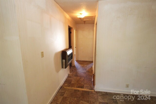 521 Short St Unit 8, Morven, NC 28119 - hallway with heating unit, baseboards, stone finish floors, and attic access