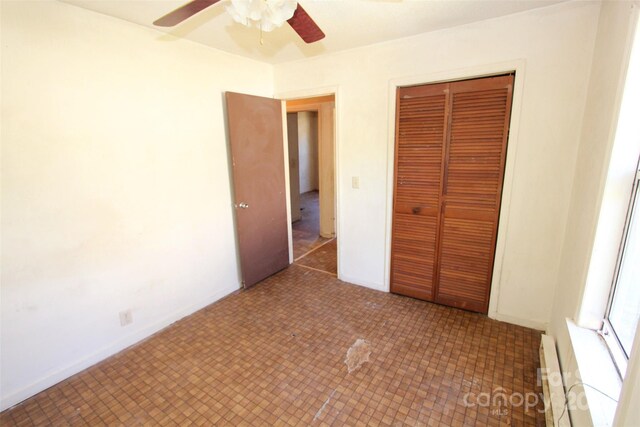 521 Short St Unit 8, Morven, NC 28119 - unfurnished bedroom with a closet, a baseboard radiator, and ceiling fan