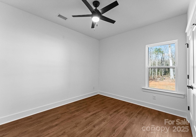 spare room featuring ceiling fan and wood-type flooring