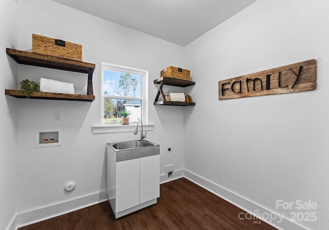 washroom with washer hookup, electric dryer hookup, sink, and dark wood-type flooring