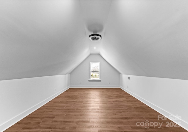 bonus room featuring hardwood / wood-style floors and lofted ceiling