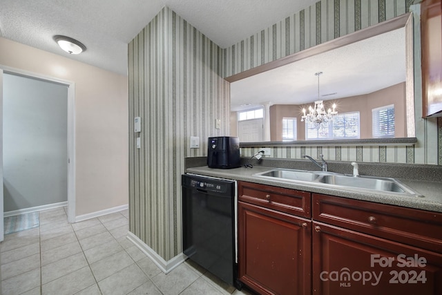 kitchen with dishwasher, hanging light fixtures, sink, a chandelier, and a textured ceiling