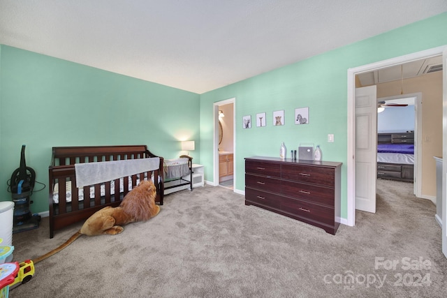 carpeted bedroom with ensuite bathroom