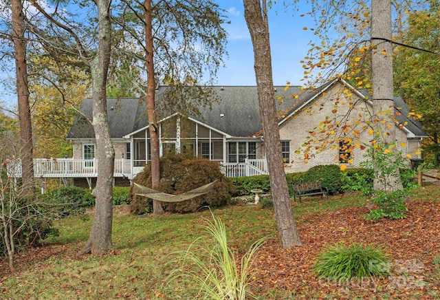 back of property featuring a sunroom