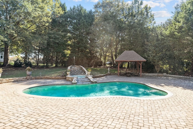 pool featuring a patio and a gazebo