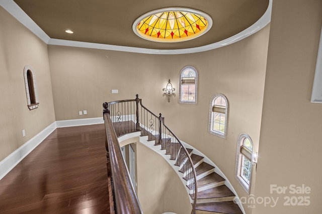 stairs featuring recessed lighting, baseboards, and wood finished floors