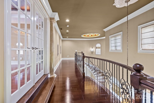 corridor with crown molding, recessed lighting, an upstairs landing, wood finished floors, and baseboards